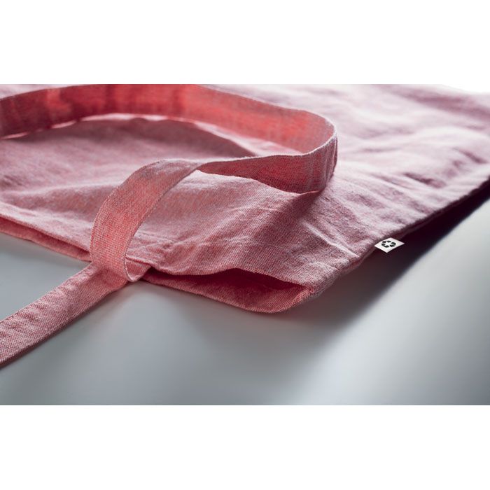 Rote Baumwolltasche mit langen Henkeln.