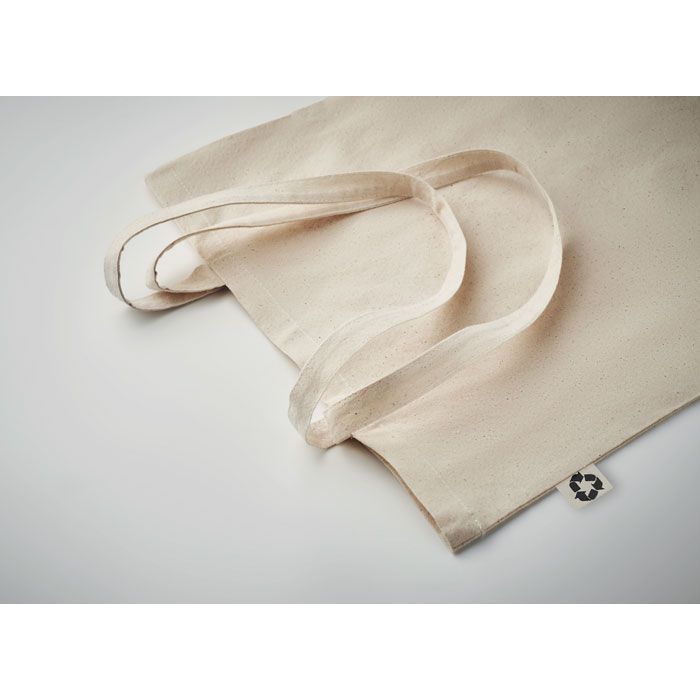 Natur farbene Baumwolltasche mit langen Henkeln.